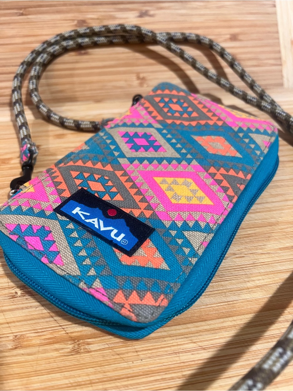 KAVU Go Time Bi-Fold Crossbody Wallet in a colorful geometric print
